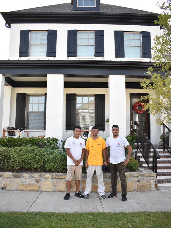 painters in front of house