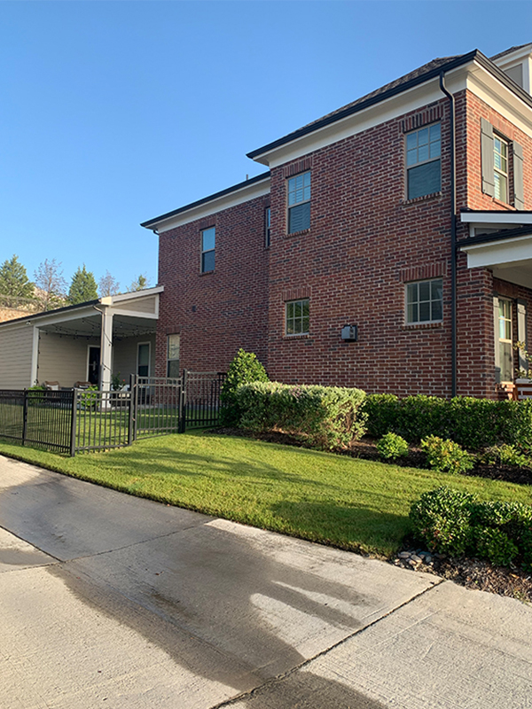 side of red brick home